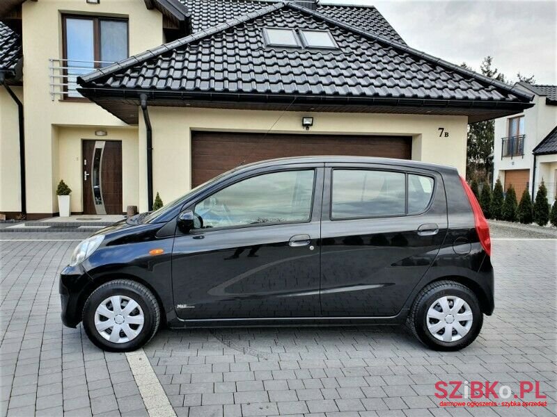 2009' Daihatsu Cuore photo #1