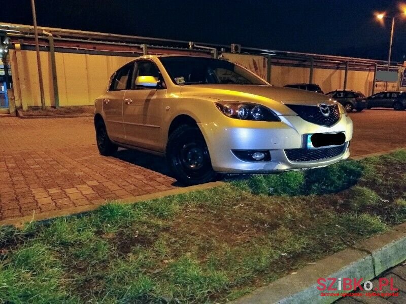 2004' Mazda 3 photo #1