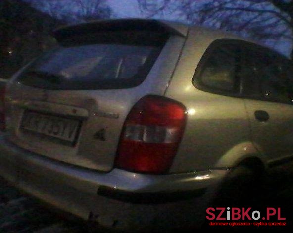 1999' Mazda 323 photo #1