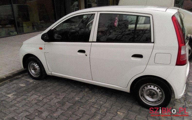 2003' Daihatsu Cuore photo #1